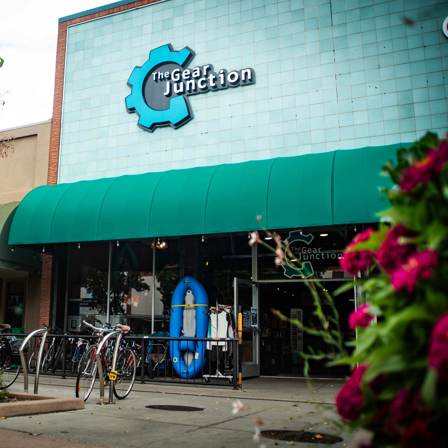 Storefront with 'The Gear Junction' logo on a building facade